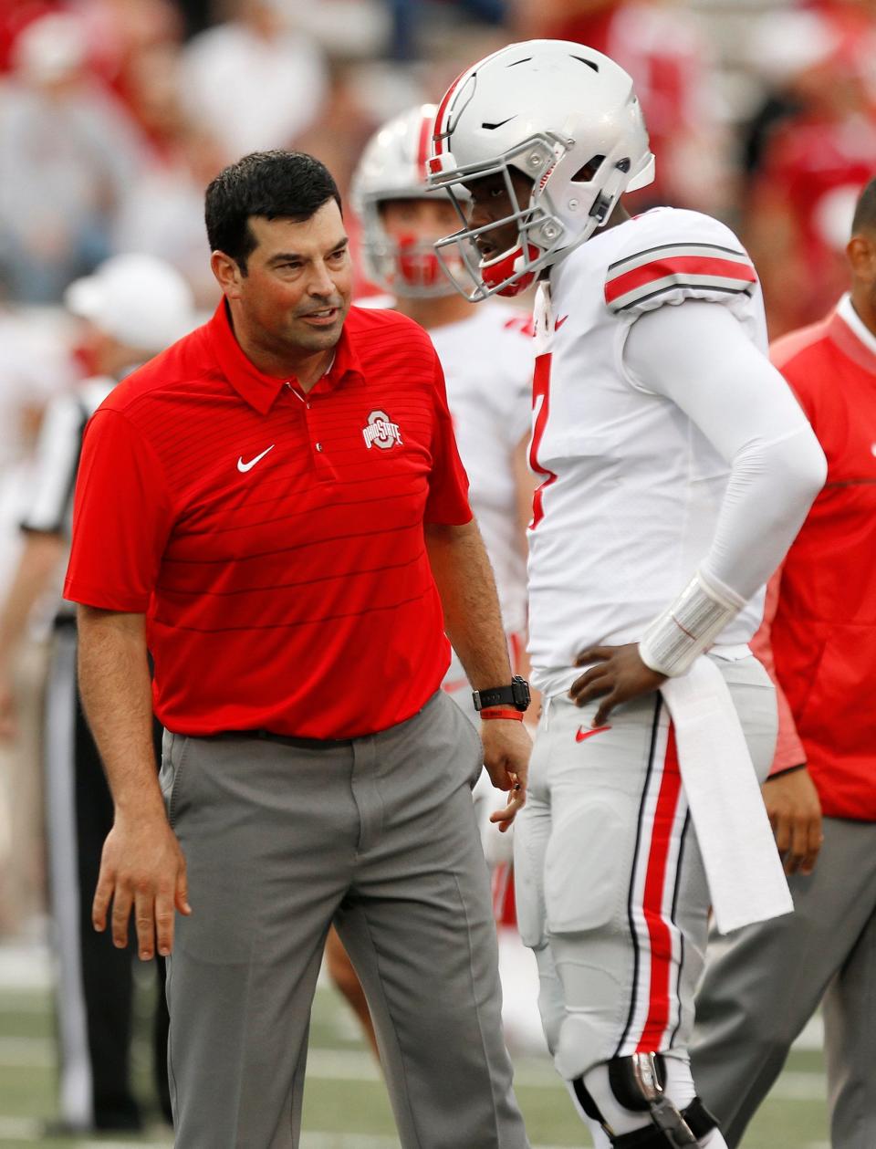 Ohio State assistant coach Ryan Day talks to quarterback Dwayne Haskins before a game in 2017.