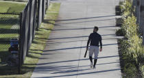 Atlanta Braves outfielder Ender Inciarte heads out for some early morning batting practice during baseball spring training at CoolToday Park in North Port, Fla., on Thursday, Feb. 25, 2021. (Curtis Compton/Atlanta Journal-Constitution via AP)