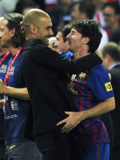 Barcelona's coach Josep Guardiola (L) embraces Barcelona's forward Lionel Messi at the end of the Spanish King's Cup final. Barcelona gave Guardiola the perfect send off Friday, beating Athletic Bilbao 3-0 in Madrid to win the Spanish Cup in the coach's last match in charge after a memorable four seasons in the Catalan hot seat