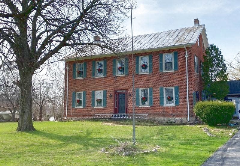 The Seitz Tavern and Stagecoach Inn, pictured Dec. 14 in Grape, was converted to a single-family home in 1899.