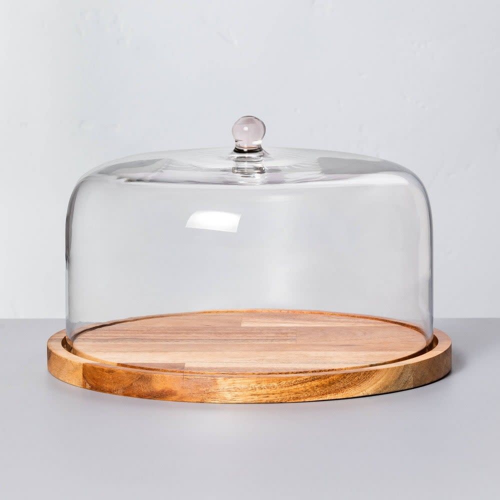 <p><a href="https://go.redirectingat.com?id=74968X1596630&url=https%3A%2F%2Fwww.target.com%2Fp%2F9-34-wood-38-glass-covered-dessert-storage-brown-hearth-38-hand-8482-with-magnolia%2F-%2FA-80178664&sref=https%3A%2F%2Fwww.countryliving.com%2Fshopping%2Fa60581172%2Fjoanna-gaines-stanley-lunch-box-target%2F" rel="nofollow noopener" target="_blank" data-ylk="slk:Shop Now;elm:context_link;itc:0;sec:content-canvas" class="link rapid-noclick-resp">Shop Now</a></p><p>9" Wood & Glass Covered Dessert Dish </p><p>target.com</p><p>$19.99</p>