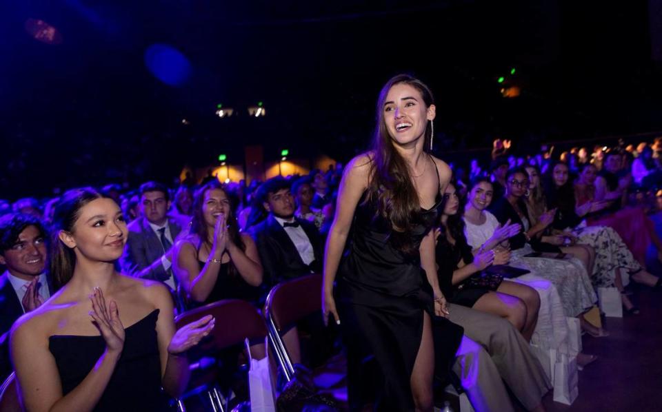 Silver Knight winner Isabella León, from Calvary Christian Academy, walks to the stage after winning in the Art category during the Miami Herald & el Nuevo Herald 65th Silver Knight Award Ceremony at the James L. Knight Center on Thursday, May 25, 2023, in downtown Miami, Fla.