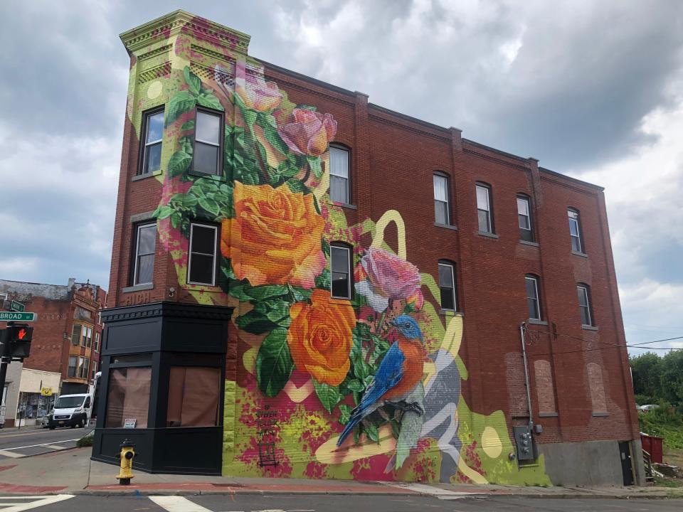 Artist Steven Teller completed a mural on the side of 265 Main St. in Johnson City as part of the iDistrict mural program.