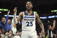 Minnesota Timberwolves guard Monte Morris (23) celebrates after making a 3-point shot at the buzzer to end the third quarter of an NBA basketball game against the Toronto Raptors, Wednesday, April 3, 2024, in Minneapolis. (AP Photo/Abbie Parr)