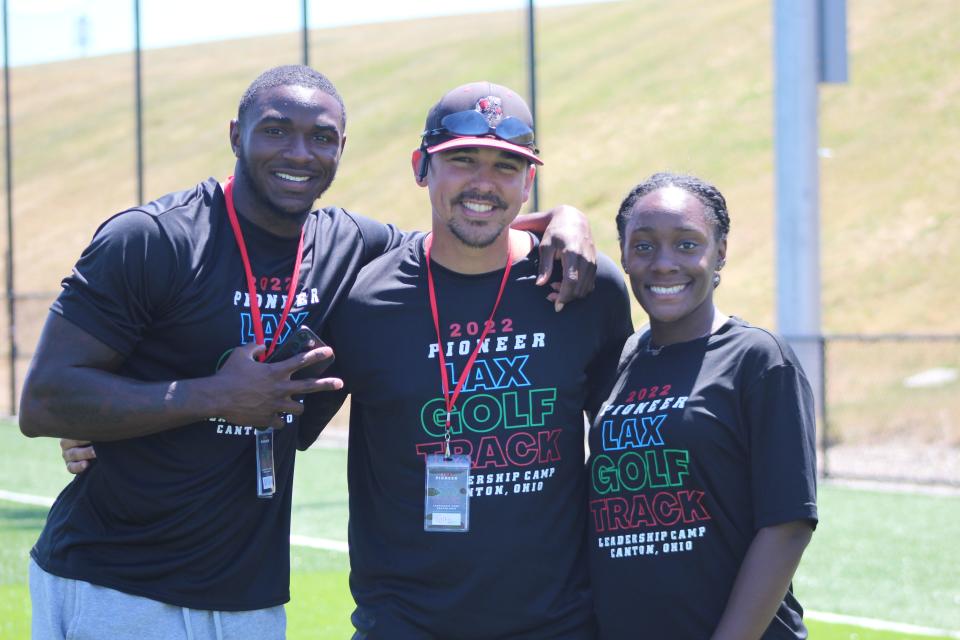 Camp counselors Tellis Horne (left), Jake Foltz (middle) and Azure Curtis pose for a picture on Thursday at the Pioneer Leadership/Exploratory Sports Camp hosted by Malone University.