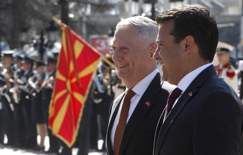 U.S. Defense Secretary James Mattis, center, is welcomed by Macedonian Prime Minister Zoran Zaev, right, upon his arrival at the government building in Skopje, Macedonia, Monday, Sept. 17, 2018. Mattis arrived in Macedonia Monday, condemning Russian efforts to use its money and influence to build opposition to an upcoming vote that could pave the way for the country to join NATO, a move Moscow opposes. (AP Photo/Boris Grdanoski)