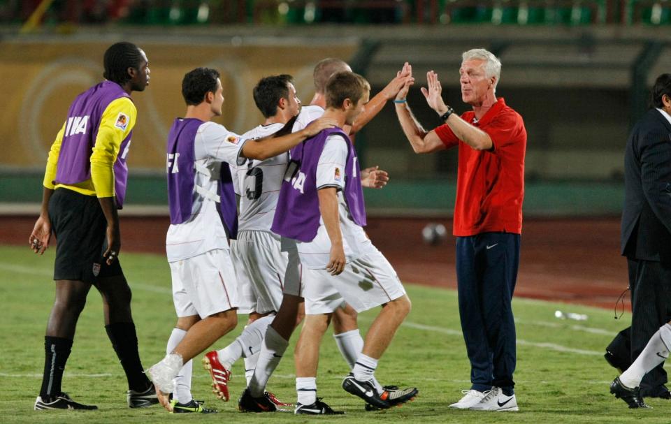 USA coach Thomas Rongen, right, congratulates his team after their 4-1 victory, at the USA vs Cameroon U-20 World Cup group C soccer match at the Mubarak stadium in Suez, Egypt, Tuesday, Sept. 29, 2009. (AP Photo/Ben Curtis)