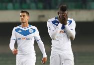 Brescia's Mario Balotelli, right, reacts at the end of the Italian Serie A soccer match between Verona and Brescia at the Bentegodi stadium in Verona, Italy, Sunday, Nov. 3, 2019. Verona supporters' racist chants upset the Italian bomber who also scored one goal. (Simone Venezia/ANSA via AP)