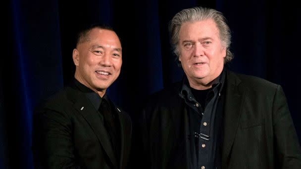 PHOTO: Former White House Chief Strategist Steve Bannon, right greets fugitive Chinese billionaire Guo Wengui before introducing him at a news conference, Nov. 20, 2018, in New York. (Don Emmert/AFP via Getty Images, FILE)