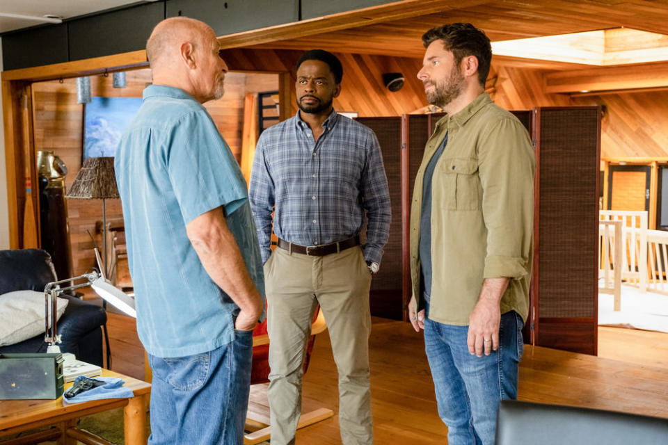 Corbin Bernsen, Dulé Hill, and James Roday Rodriguez standing in a den