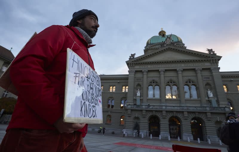 Fernandez stands during his hunger strike in the Federal Square in a bid to make Swiss government take bold action on climate change to safeguard his children's future in Bern