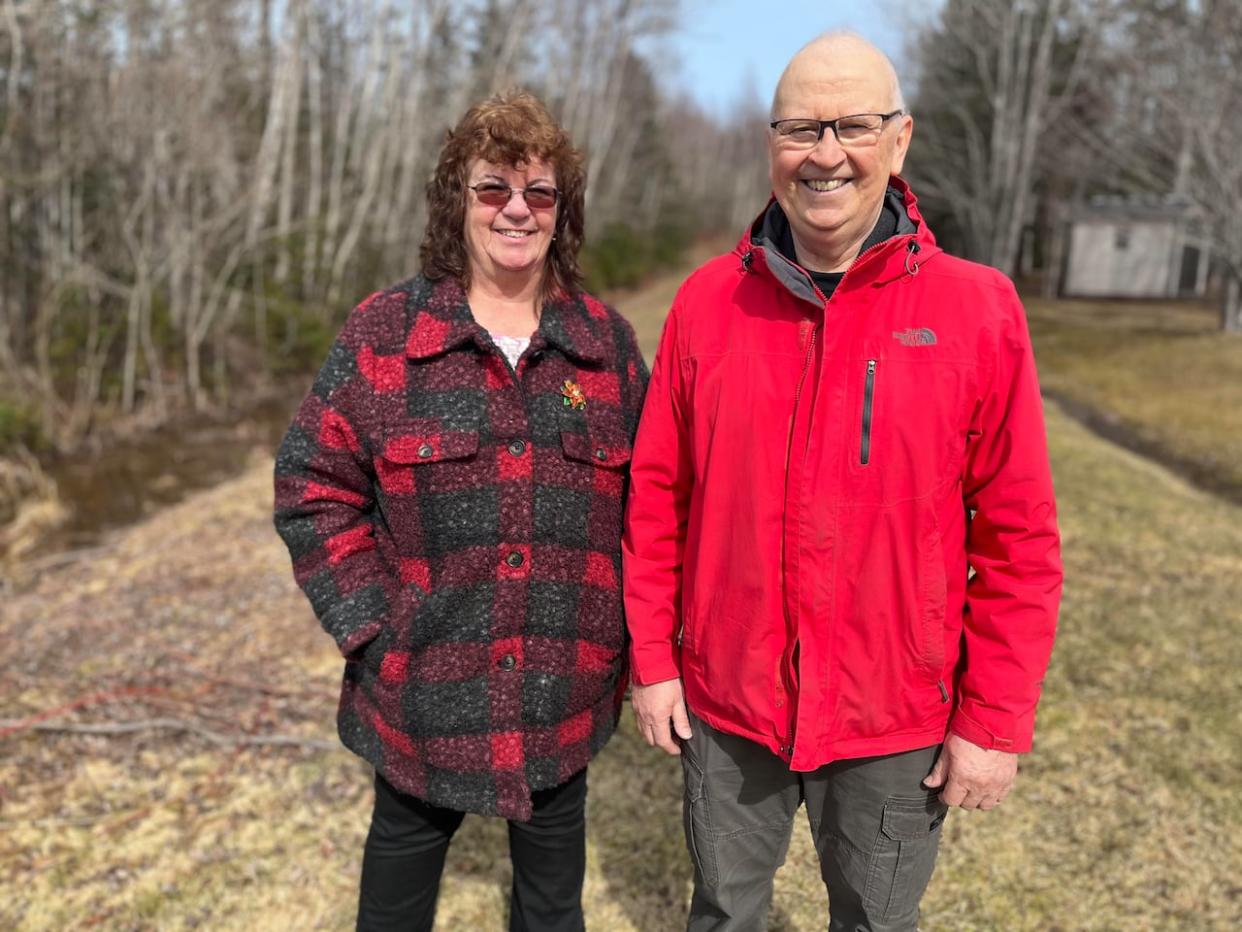 Wellington Mayor Irene MacCaull, left, and the municipality's chief administrative officer Jean-Pierre Arsenault stand at the site of a future housing development.  (Wayne Thibodeau/CBC - image credit)