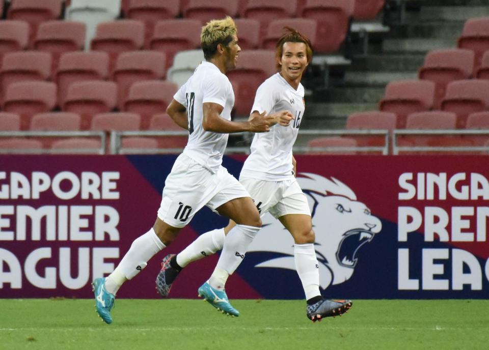 Myanmar striker Kyaw Ko Ko (left) celebrates his second goal against Singapore in their international friendly match at the National Stadium. (PHOTO: Zainal Yahya/Yahoo News Singapore)