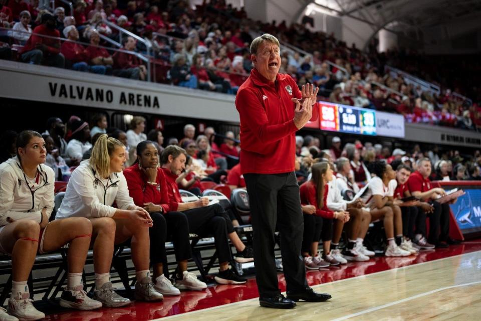 Wolfpack coach Wes Moore calls a timeout during an NC State women's basketball game against visiting Charlotte on Wednesday, Nov. 16, 2022, at Reynolds Coliseum in Raleigh.