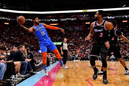 Feb 1, 2019; Miami, FL, USA; Oklahoma City Thunder forward Paul George (13) attempts to keep the ball in bounds against the Miami Heat during the first half at American Airlines Arena. Mandatory Credit: Jasen Vinlove-USA TODAY Sports