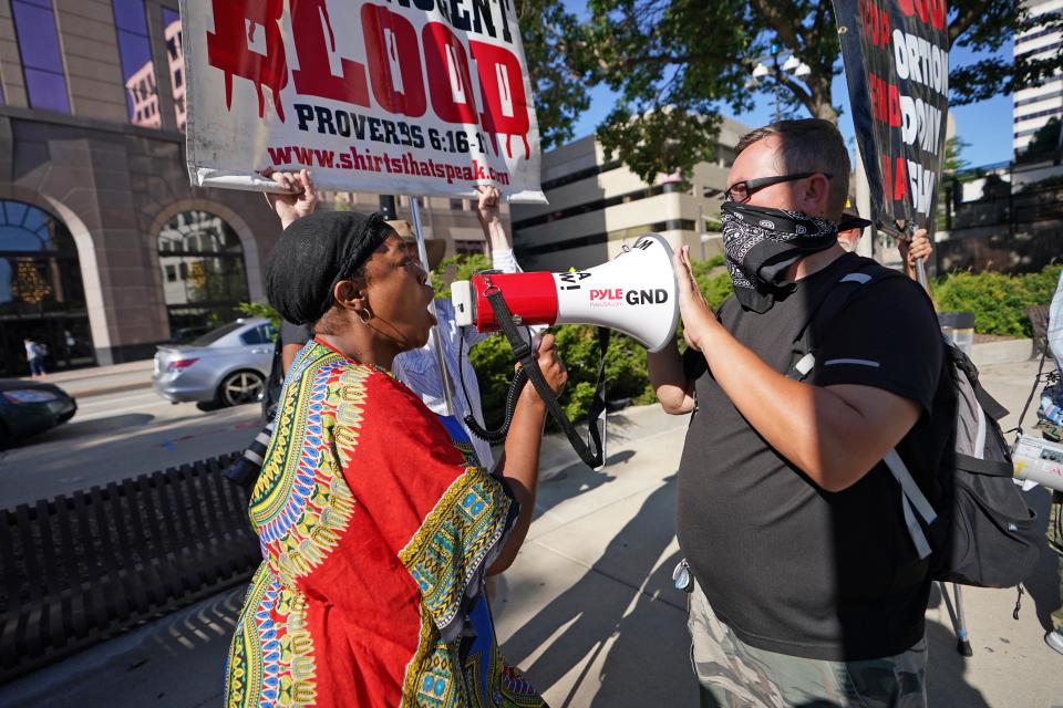 A woman confronts a group of anti-abortion advocates in this 2020 photo at Red Arrow Park.