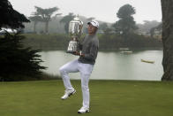 Collin Morikawa holds the Wanamaker Trophy after winning the PGA Championship golf tournament at TPC Harding Park Sunday, Aug. 9, 2020, in San Francisco. (AP Photo/Jeff Chiu)