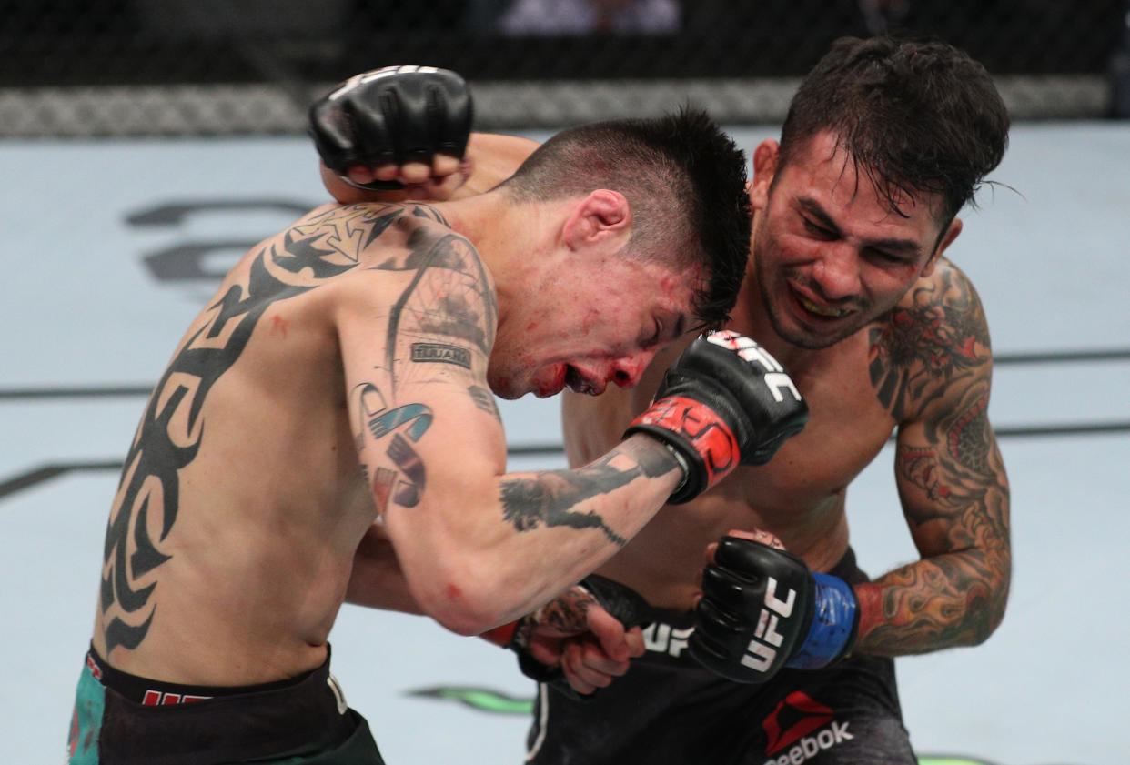 SANTIAGO, CHILE - MAY 19:  (R-L) Alexandre Pantoja of Brazil punches Brandon Moreno of Mexico in their flyweight bout during the UFC Fight Night event at Movistar Arena on May 19, 2018 in Santiago, Chile. (Photo by Buda Mendes/Zuffa LLC/Zuffa LLC via Getty Images)