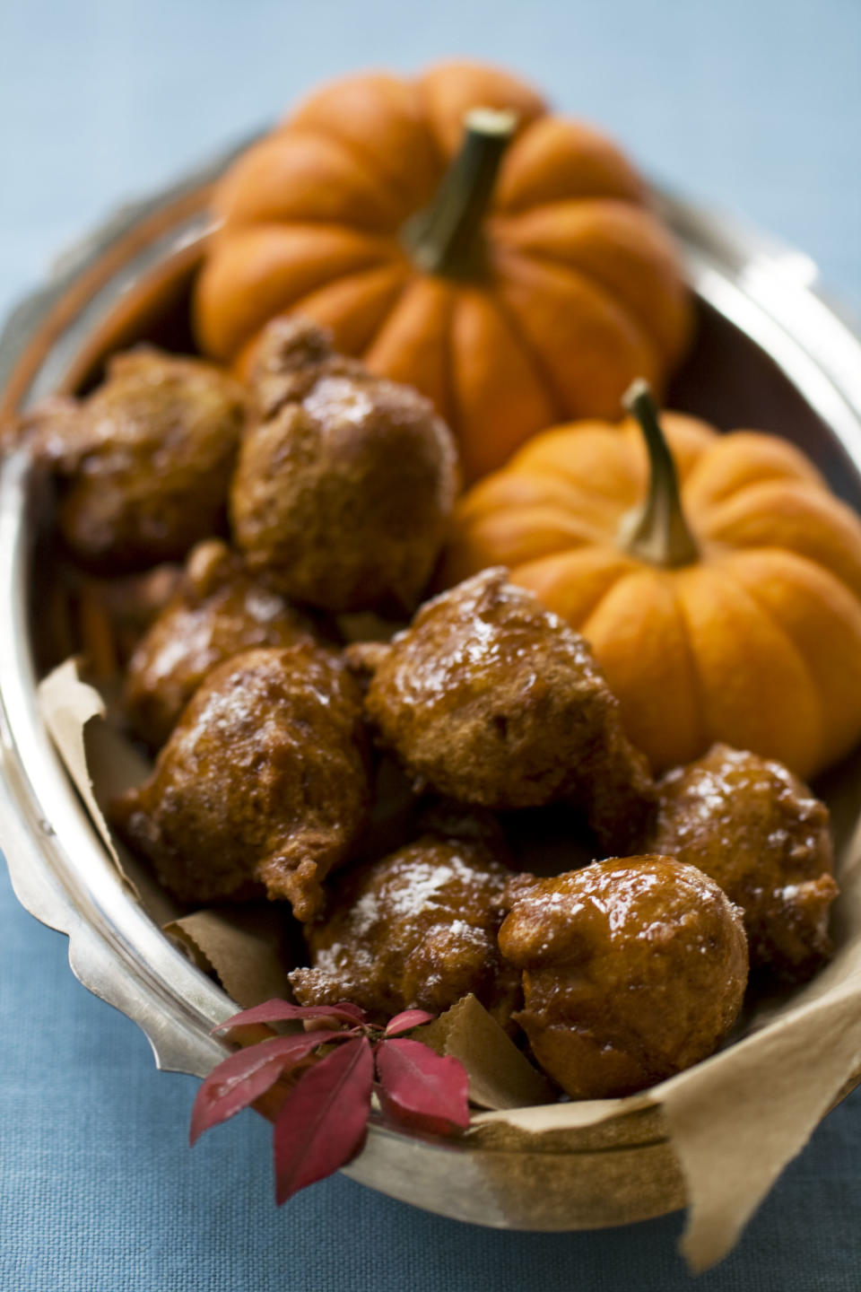 This Oct. 7, 2013 photo shows pumpkin honey doughnuts in Concord, N.H. To help bridge the holidays of Hanukkah and Thanksgiving, this recipe combines the classic fried doughnut from Hanukkah and pumpkin pie from Thanksgiving, into one delicious treat. (AP Photo/Matthew Mead)