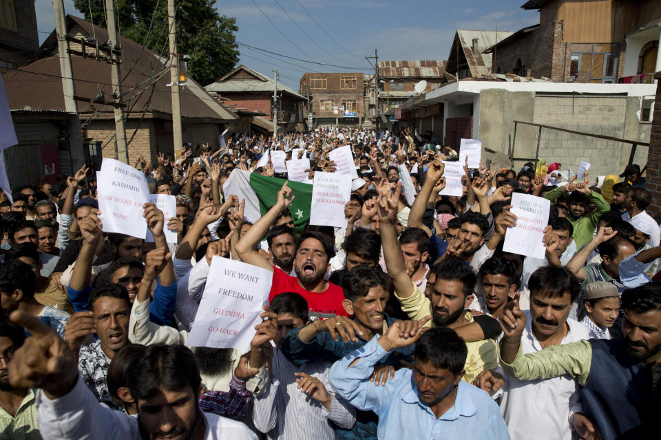 Kashmiri Muslims shout slogans during a protest after Eid prayers in Srinagar, Indian controlled Kashmir, Monday, Aug. 12, 2019. Troops in India-administered Kashmir allowed some Muslims to walk to local mosques alone or in pairs to pray for the Eid al-Adha festival on Monday during an unprecedented security lockdown that still forced most people in the disputed region to stay indoors on the Islamic holy day. (AP Photo/ Dar Yasin)