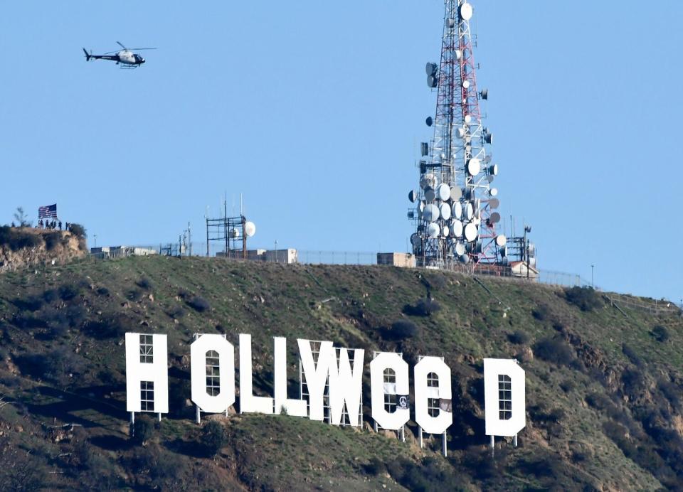 The Hollywood sign is altered to read "Hollyweed."
