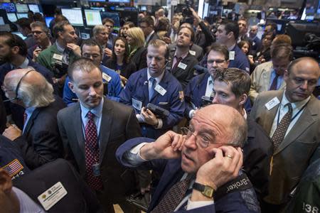 Traders wait for Q2 Holdings, Inc. to begin trading during their IPO on the floor of the New York Stock Exchange March 20, 2014. REUTERS/Brendan McDermid