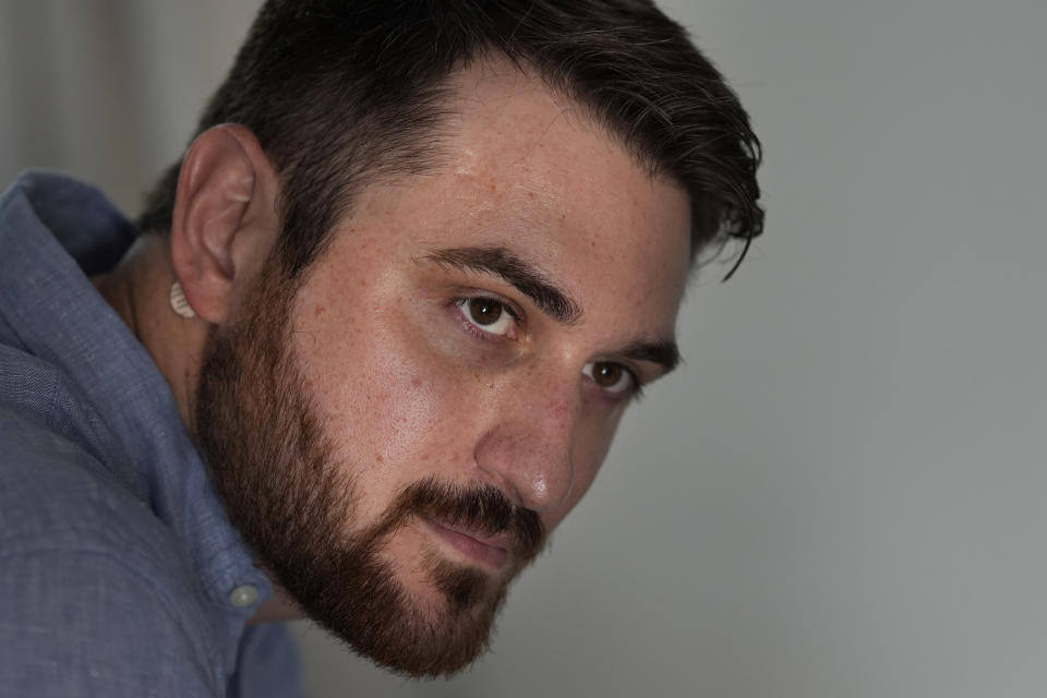 Cancer patient Steven Manetta sits for a portrait Thursday, Aug. 29, 2024, in his Lemont, Ill., home. Manetta takes at least a dozen pills daily to keep a form of the blood cancer leukemia in remission. (AP Photo/Charles Rex Arbogast)