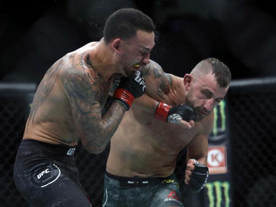 Max Holloway (left) dropped his belt to Alexander Volkanovski via unanimous decision (Getty Images)