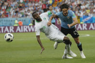 <p>Edinson Cavani and Osama Hawsawi challenge for the ball </p>