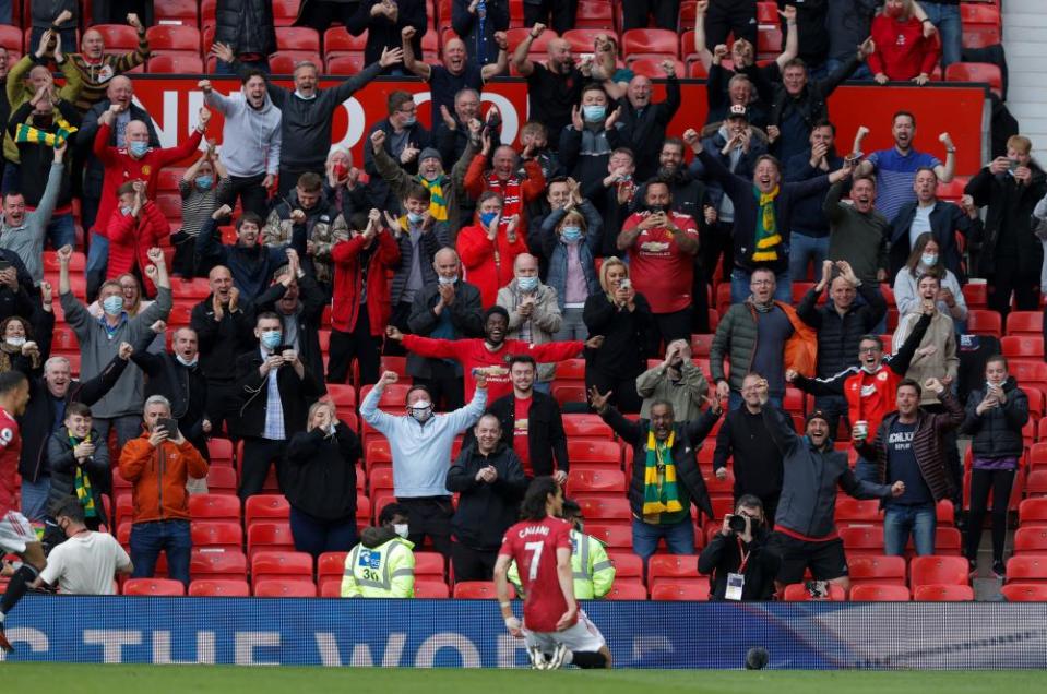 Edinson Cavani celebrates his goal in front of delighted fans at Old Trafford.