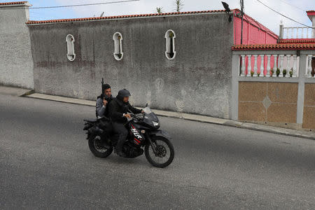 Tactical police members are seen during a shootout between security forces and rogue Venezuelan helicopter pilot Oscar Perez, in Caracas, Venezuela January 15, 2018. REUTERS/Marco Bello