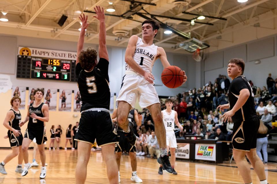 Bushland’s Cole Purcell (1) passing the ball mid jump during a district game Tuesday February 1st, Canadian at Bushland in Bushland, TX. Trevor Fleeman/For Amarillo Globe-News.