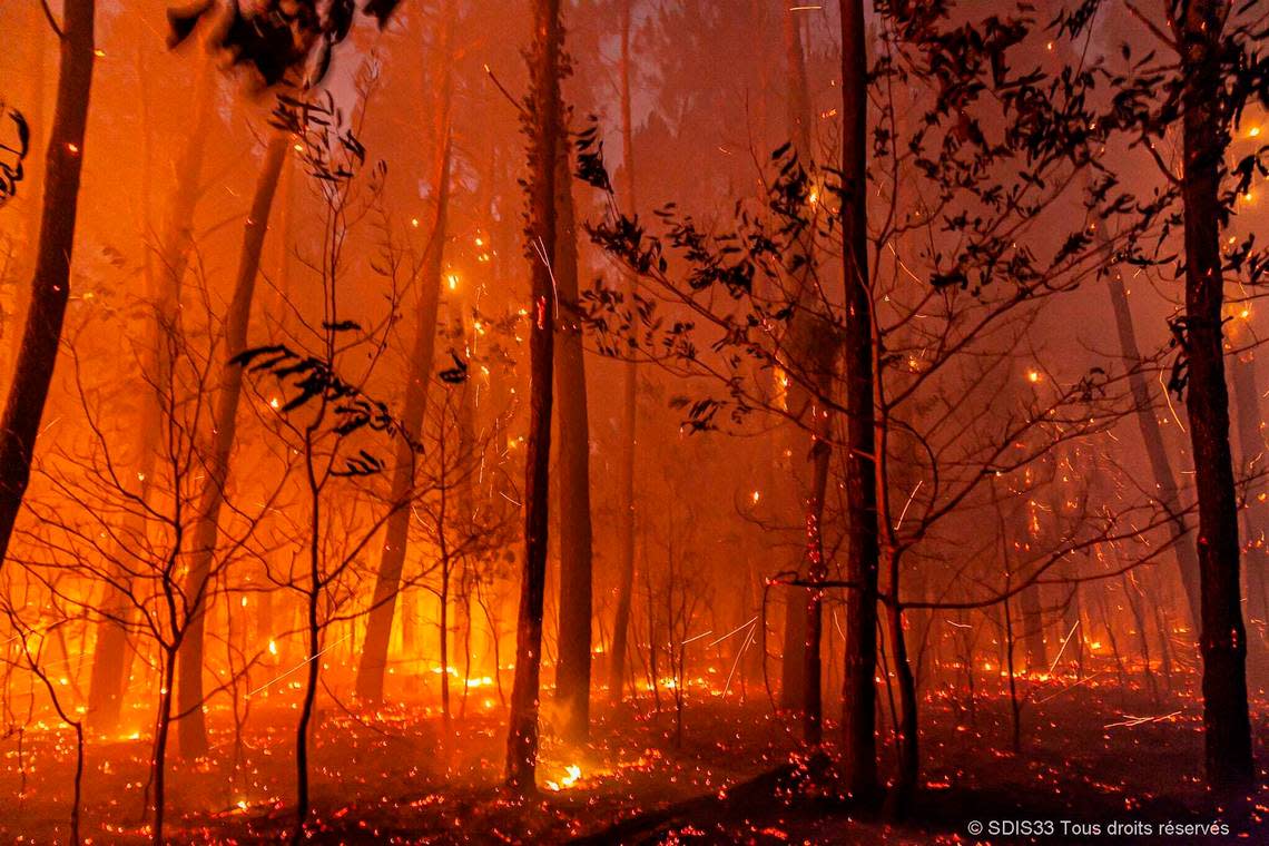 This photo provided by the fire brigade of the Gironde region (SDIS 33) shows a wildfire near Landiras, southwestern France, Sunday July 17, 2022 . Firefighters battled wildfires raging out of control in France and Spain on Sunday as Europe wilted under an unusually extreme heat wave that authorities in Madrid blamed for hundreds of deaths. (SDIS 33 via AP)