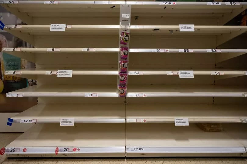 Empty shelves in a Cardiff Tesco store