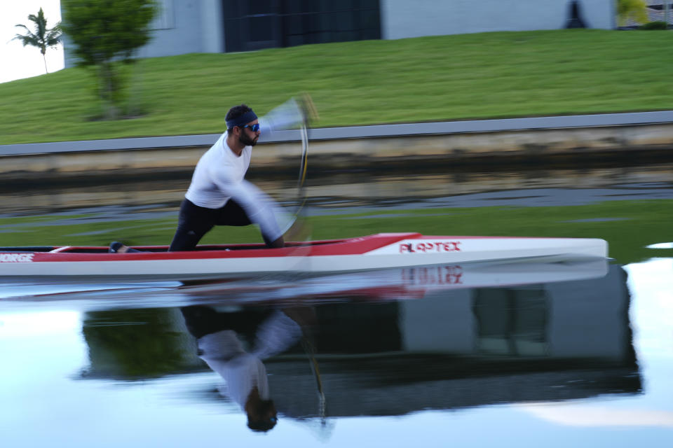 Rower Fernando Dayan Jorge paddles his canoe during a training session ahead of the 2024 Paris Olympics, Wednesday, June 26, 2024, in Cape Coral, Fla. Jorge, who will compete in canoe sprint for the Olympic Refugee team, rowed for his native country Cuba in the Rio 2016 and the Toyko 2020 Olympics, where he won a gold medal in Men's Canoe Double 1000m and finished seventh in the singles event. (AP Photo/Rebecca Blackwell)