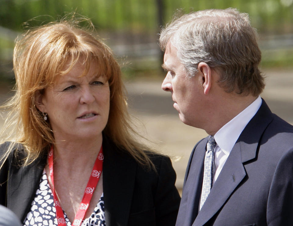 Sarah Ferguson, The Duchess of York talks with ex-husband HRH Prince Andrew, The Duke of York as they wait for daughter HRH Princess Beatrice of York to complete the Virgin London Marathon as part of the 'Caterpillar Run' Team, consisting of 32 runners tethered together on April 25, 2010 