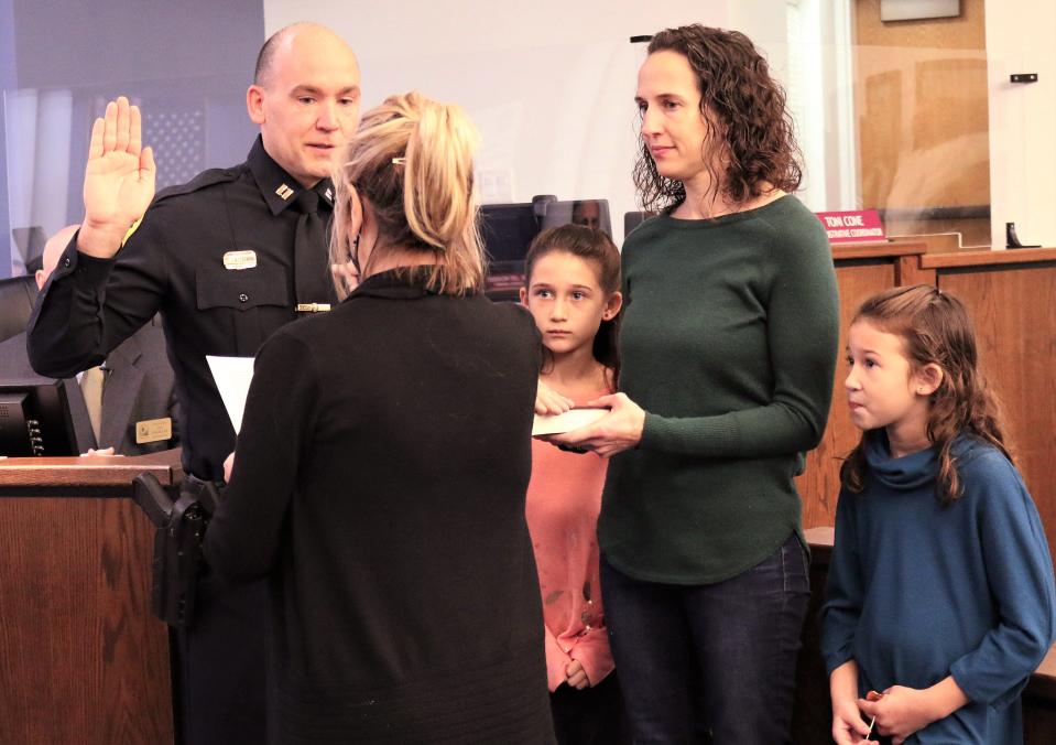 Venice Police Department Lt. Andy Leisenring is promoted to Police Captain and sworn in during Tuesday's City Council meeting by City Clerk Kelly Michaels. Capt. Leisenring's wife Melissa pinned on his badge under the watchful eyes of their daughters, Madison and Olivia.
