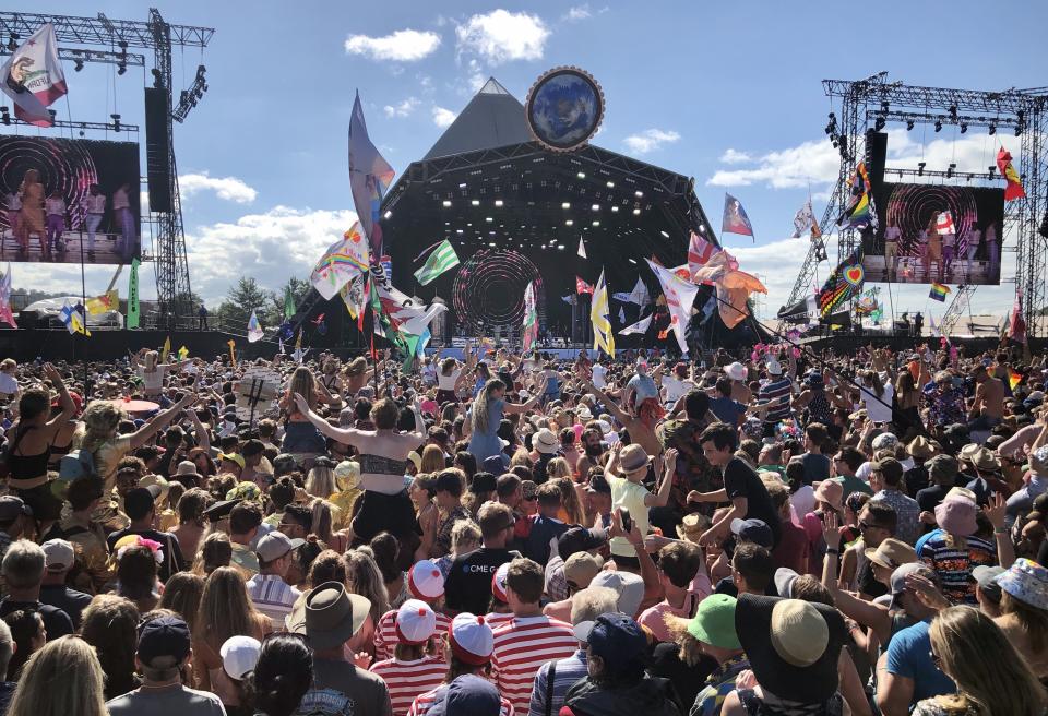 Crowds listen to Kylie perform on the Pyramid Stage at the 2019 Glastonbury Festival held at Worthy Farm, in Pilton, Somerset on June 30, 2019 near Glastonbury, England. The festival, founded in 1970, has grown into one of the largest outdoor green field festivals in the world.