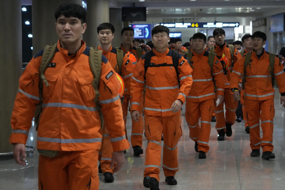 South Korean rescue team members arrive to board a plane to leave for quake-ravaged Turkey at the Incheon International Airport in Incheon, South Korea, Tuesday, Feb. 7, 2023. (AP Photo/(AP Photo/Ahn Young-joon)