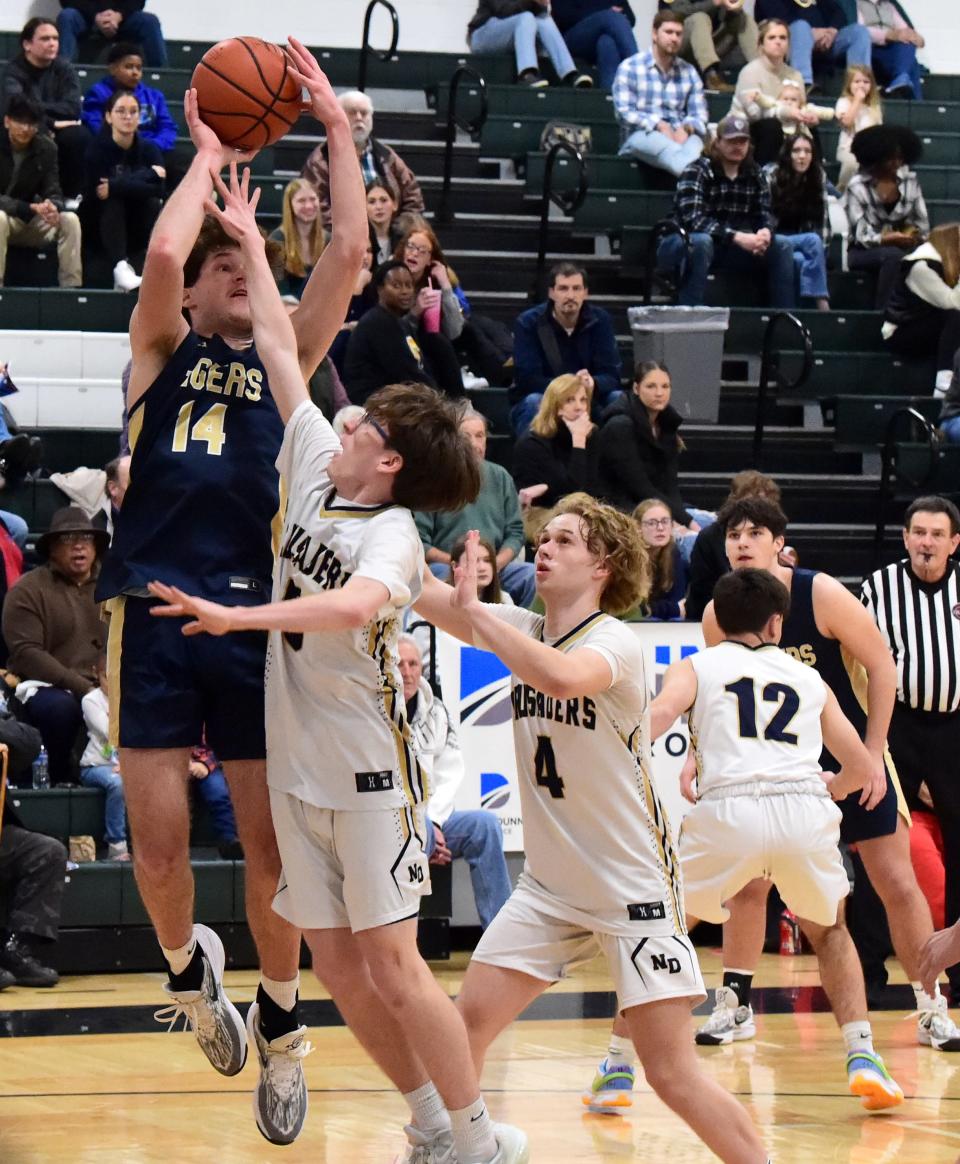North Penn-Mansfield's Karson Dominick goes up for a shot during a 65-30 win over Elmira Notre Dame in the Boys Regional Division I championship game at the Josh Palmer Fund Clarion Classic on Dec. 30, 2023 at Elmira High School.