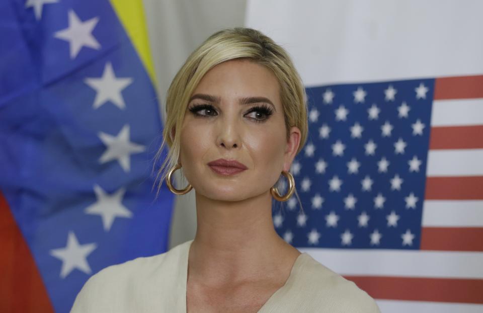 Ivanka Trump, President Donald Trump's daughter and White House adviser, backdropped by United States and Venezuelan flags looks on after a meeting with a delegation representing Venezuelan opposition leader Juan Guaido, at a migrant shelter in La Parada near Cucuta, Colombia, Wednesday, Sept. 4, 2019. (AP Photo/Fernando Vergara)