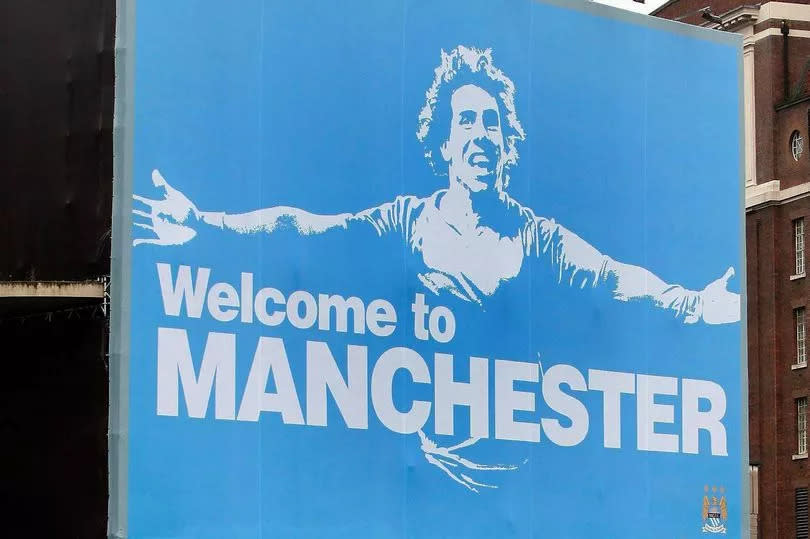 A Manchester City FC poster bearing the face of new signing and former Manchester United striker Carlos Tevez