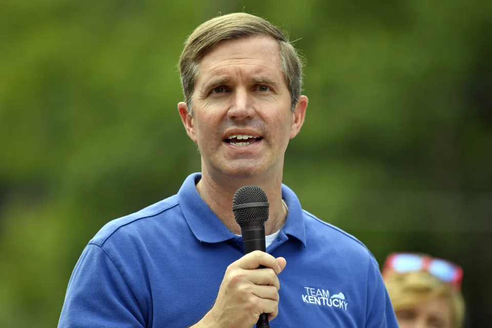 Kentucky Gov. Andy Beshear speaks at the Wayland Volunteer Fire Station in Wayland, Ky., Friday, July 26, 2024. Beshear handed over the keys to newly constructed homes to families that were displaced by the flooding 2 years ago. (AP Photo/Timothy D. Easley)