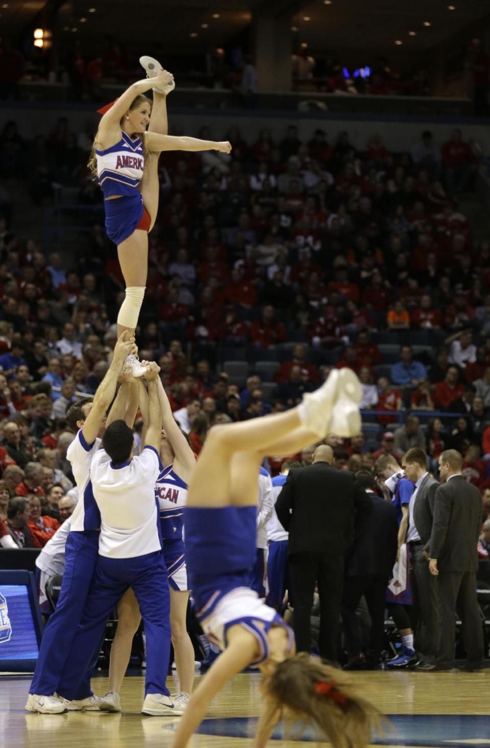 American cheerleaders perform during the first half of a second-round game in the NCAA college basketball tournament Thursday, March 20, 2014, in Milwaukee. (AP Photo/Jeffrey Phelps)