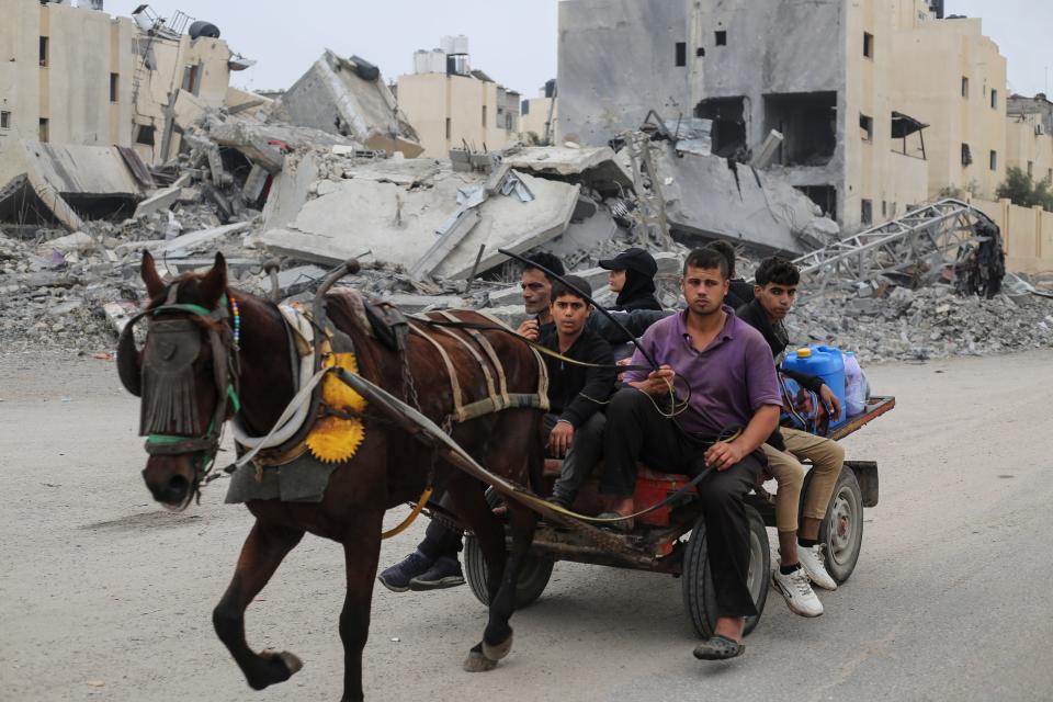 Palestinians fleeing the Israeli ground offensive arrive in Rafah, Gaza Strip, on Dec. 5, 2023.