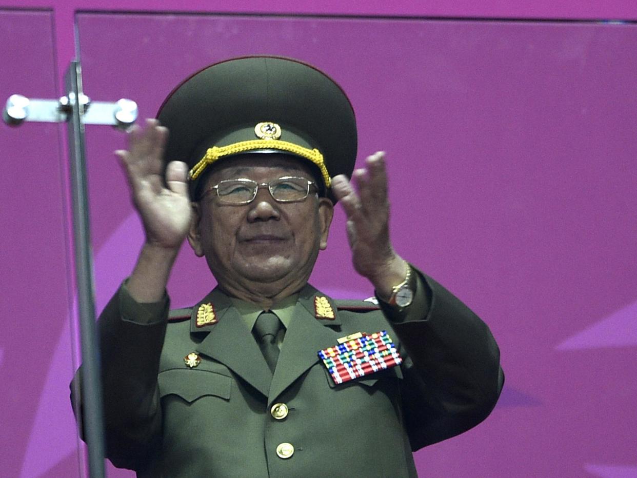 North Korean director of the military's General Political Bureau, the top military post in North Korea, Hwang Pyong-So, stands and applauds as North Korean athletes join athletes from other nations in the arena during the closing ceremony of the 2014 Asian Games at The Incheon Asiad Main Stadium: MARTIN BUREAU/AFP/Getty Images