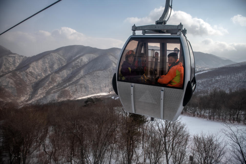 North Korean skiers ride in a gondola to the summit of the 1,360-metre Taehwa Peak at Masikryong Ski Resort on Feb. 5, near Wonsan, North Korea.