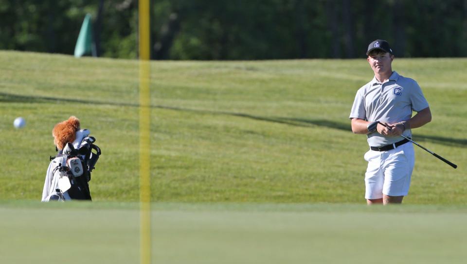 Carroll Porter Dick watches his shot during the IHSAA boys golf regional, Friday, June 7, 2024, at Coyote Crossing Golf Club in West Lafayette, Ind.