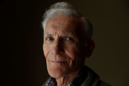 Former Tuam mother-and-baby home resident Peter Mulryan, poses for a photograph at a hotel in Ballinasloe, western Ireland March 8, 2017. REUTERS/Peter Nicholls