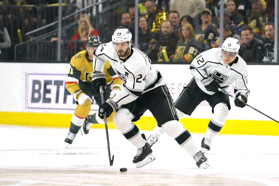 Los Angeles Kings center Phillip Danault (24) skates with the puck during the first period of an NHL hockey game against the Vegas Golden Knights, Thursday, April 6, 2023, in Las Vegas. (AP Photo/Lucas Peltier)